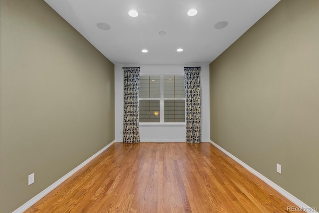 17223 W 84th Dr, Arvada, CO 80007 - spare room featuring wood finished floors, recessed lighting, and baseboards