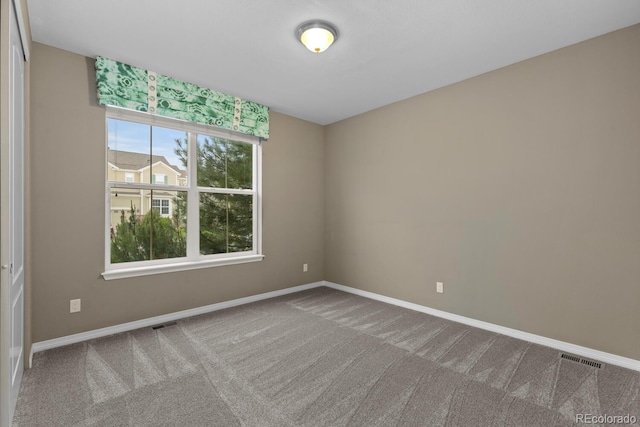 17223 W 84th Dr, Arvada, CO 80007 - carpeted spare room featuring baseboards