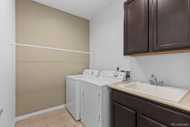 17223 W 84th Dr, Arvada, CO 80007 - clothes washing area featuring cabinet space, independent washer and dryer, and baseboards