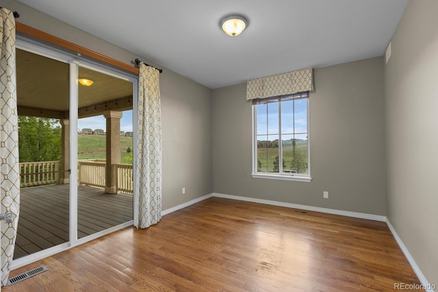 17223 W 84th Dr, Arvada, CO 80007 - spare room featuring wood finished floors and baseboards