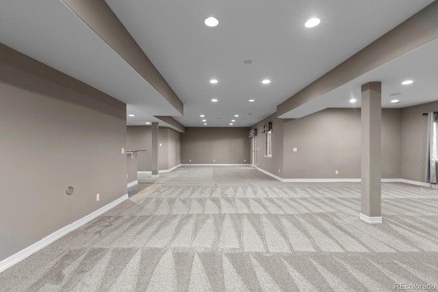 17223 W 84th Dr, Arvada, CO 80007 - finished below grade area with light carpet, baseboards, and recessed lighting