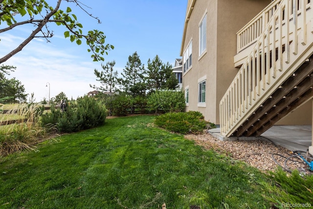 17223 W 84th Dr, Arvada, CO 80007 - view of grassy yard featuring stairs