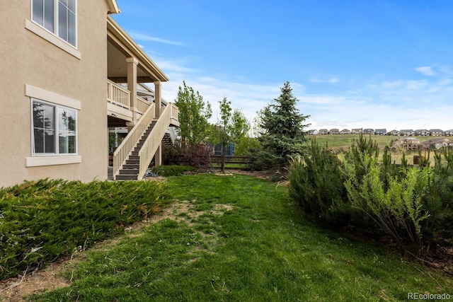 17223 W 84th Dr, Arvada, CO 80007 - view of grassy yard with stairs