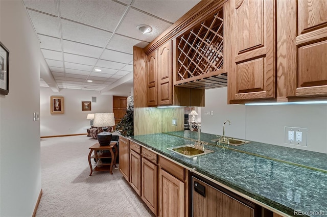 7769 W 70th Dr, Arvada, CO 80004 - kitchen with light colored carpet and a paneled ceiling