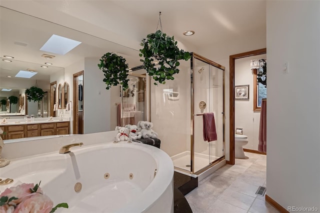 7769 W 70th Dr, Arvada, CO 80004 - bathroom featuring a skylight, a shower stall, a jetted tub, vanity, and recessed lighting