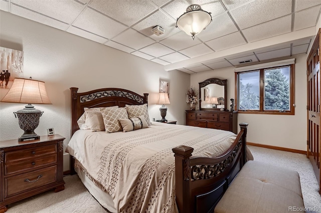 7769 W 70th Dr, Arvada, CO 80004 - bedroom with light colored carpet and a paneled ceiling