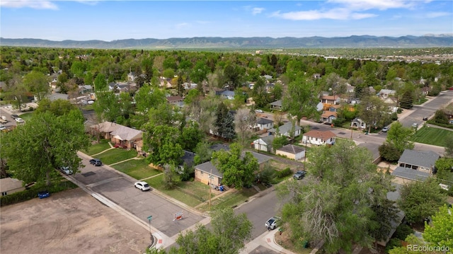 aerial overview of property's location featuring nearby suburban area and mountains