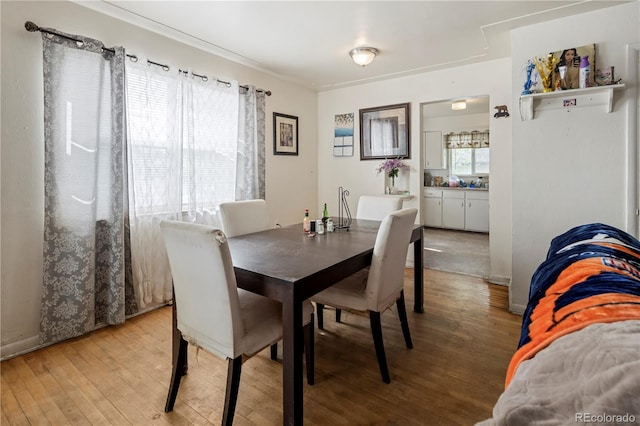 dining space featuring light wood finished floors