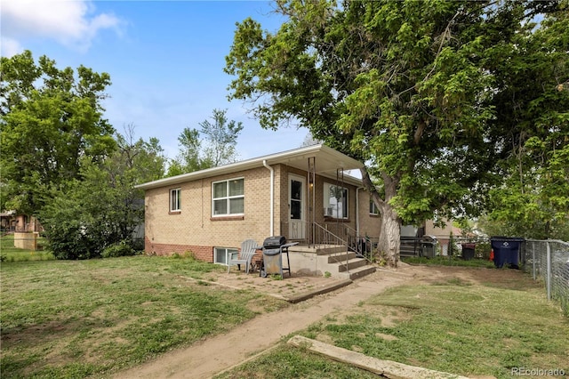 rear view of house featuring brick siding