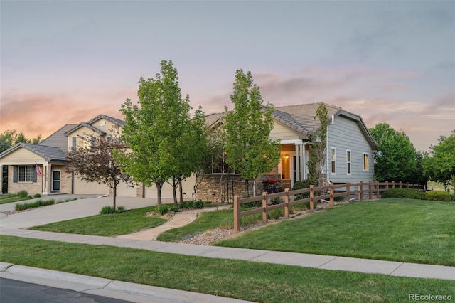 16815 E Prairie Goat Ave, Parker, CO 80134 - obstructed view of property with driveway, a tiled roof, and stone siding