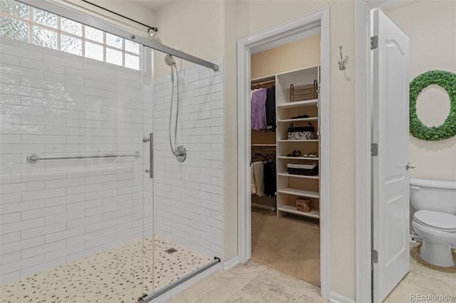 16815 E Prairie Goat Ave, Parker, CO 80134 - bathroom with a shower stall, toilet, and a spacious closet