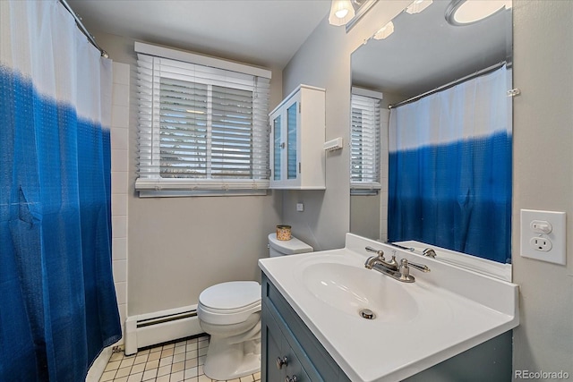 bathroom featuring a baseboard radiator, large vanity, tile floors, and toilet