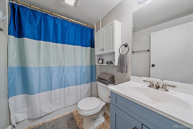 bathroom featuring vanity with extensive cabinet space, toilet, and tile flooring