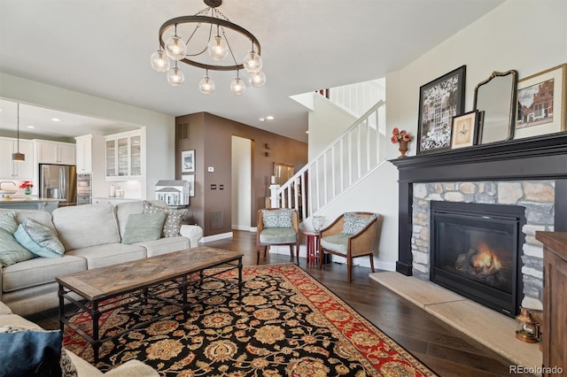3741 Harvard Pl, Broomfield, CO 80023 - living room with stairs, wood finished floors, a fireplace, a chandelier, and recessed lighting