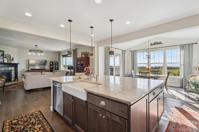 3741 Harvard Pl, Broomfield, CO 80023 - kitchen with dishwasher, dark wood-style floors, dark brown cabinets, a kitchen island with sink, and light stone countertops