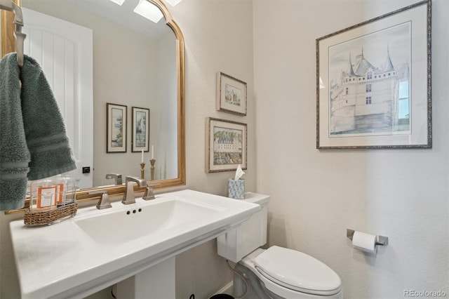 3741 Harvard Pl, Broomfield, CO 80023 - half bathroom featuring toilet and a sink