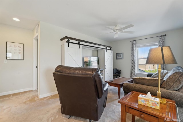 3741 Harvard Pl, Broomfield, CO 80023 - living room featuring light carpet, a barn door, and a ceiling fan