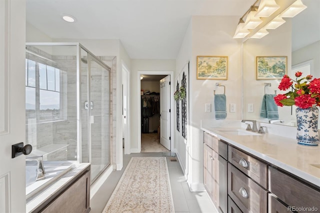 3741 Harvard Pl, Broomfield, CO 80023 - bathroom featuring double vanity, a stall shower, tile patterned flooring, a spacious closet, and a bath