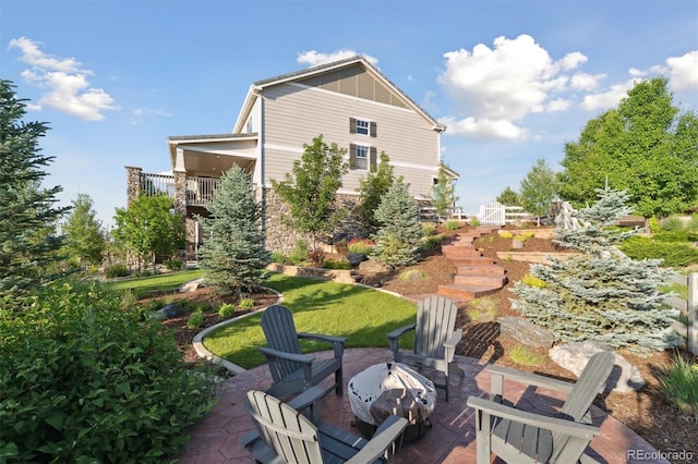 3741 Harvard Pl, Broomfield, CO 80023 - back of property featuring a fire pit, a patio, and stone siding