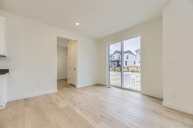 39857 Floyd St, Elizabeth, CO 80107 - unfurnished living room featuring light wood-style floors and recessed lighting