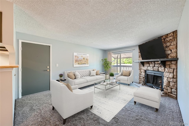 carpeted living room featuring a textured ceiling and a stone fireplace