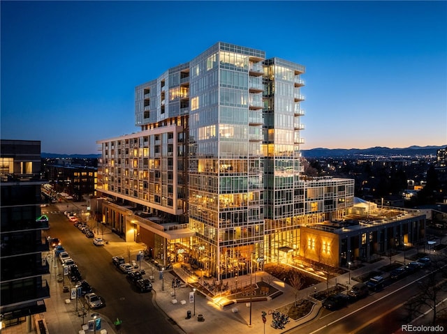 property at dusk with a view of city