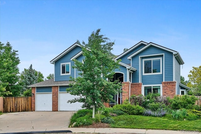 19113 W 60th Ln, Golden, CO 80403 - traditional home with brick siding, concrete driveway, and an attached garage
