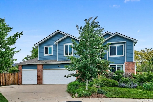 19113 W 60th Ln, Golden, CO 80403 - view of front facade featuring brick siding, driveway, and a garage
