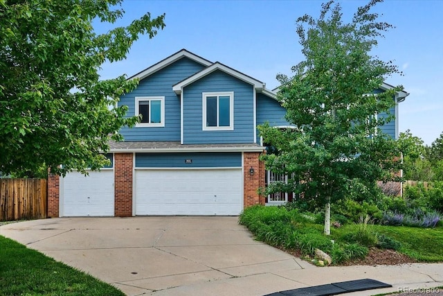 19113 W 60th Ln, Golden, CO 80403 - view of front of house with brick siding, an attached garage, and concrete driveway