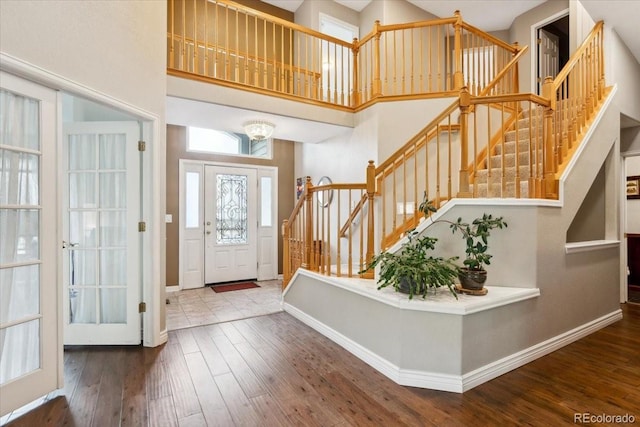 19113 W 60th Ln, Golden, CO 80403 - foyer entrance featuring a towering ceiling, wood-type flooring, and stairs