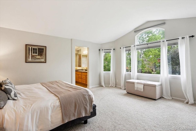 19113 W 60th Ln, Golden, CO 80403 - bedroom featuring vaulted ceiling, light colored carpet, and ensuite bath
