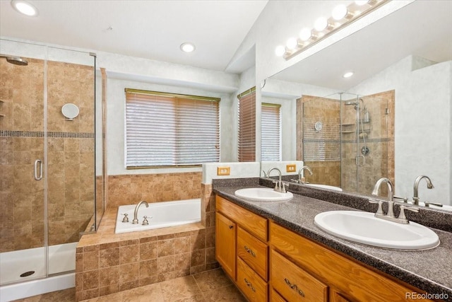 19113 W 60th Ln, Golden, CO 80403 - full bathroom with double vanity, a garden tub, a stall shower, tile patterned flooring, and recessed lighting