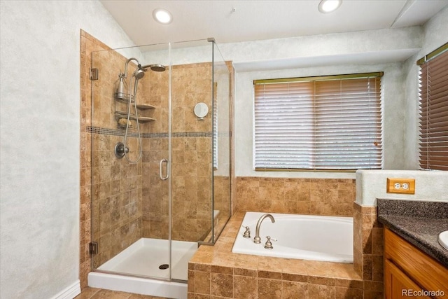 19113 W 60th Ln, Golden, CO 80403 - full bathroom with a garden tub, vanity, a stall shower, and recessed lighting