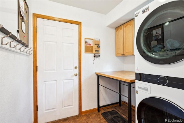 19113 W 60th Ln, Golden, CO 80403 - laundry room featuring cabinet space and estacked washer and dryer