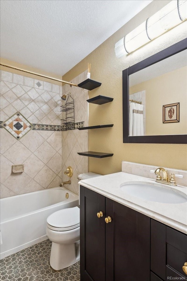 19113 W 60th Ln, Golden, CO 80403 - bathroom featuring vanity, shower / bathtub combination with curtain, a textured ceiling, and a textured wall