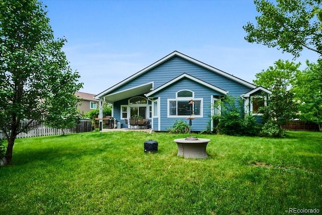 19113 W 60th Ln, Golden, CO 80403 - back of house featuring a patio area and an outdoor fire pit