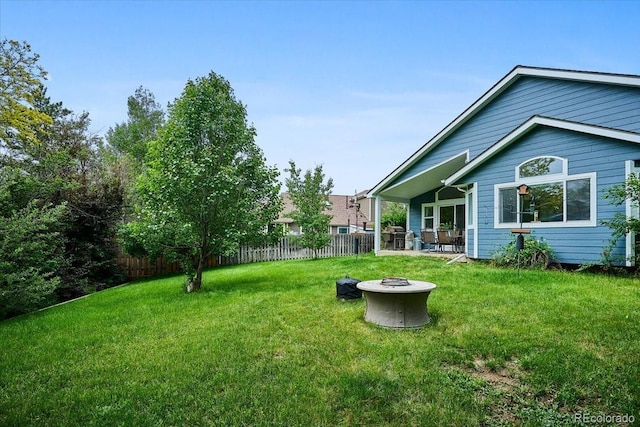 19113 W 60th Ln, Golden, CO 80403 - fenced yard featuring a fire pit and a patio area