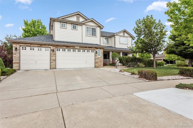17391 E Weaver Ave, Aurora, CO 80016 - view of front of home featuring concrete driveway, a front lawn, a garage, stone siding, and a shingled roof