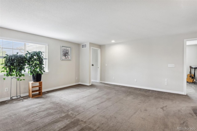 17391 E Weaver Ave, Aurora, CO 80016 - carpeted empty room with baseboards, recessed lighting, and a textured ceiling