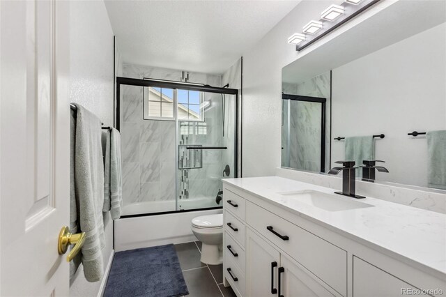 17391 E Weaver Ave, Aurora, CO 80016 - full bathroom featuring vanity, toilet, enclosed tub / shower combo, and tile patterned flooring