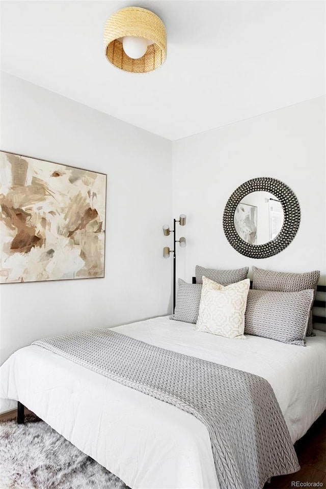 bedroom with wood finished floors