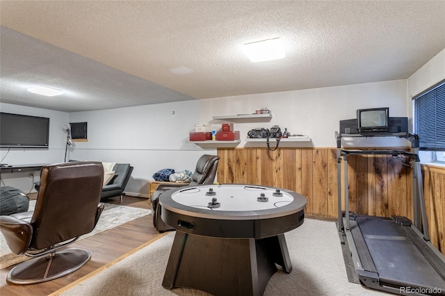750 S Dearborn Ct, Aurora, CO 80012 - recreation room with a textured ceiling and light wood finished floors