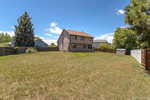 750 S Dearborn Ct, Aurora, CO 80012 - back of house with a storage shed and a fenced backyard