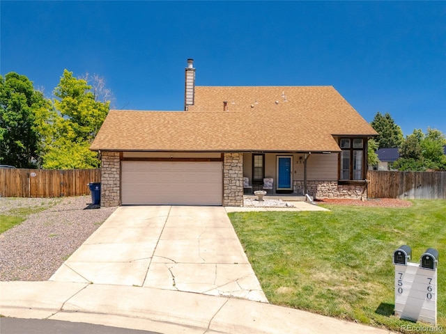 750 S Dearborn Ct, Aurora, CO 80012 - view of front of property featuring stone siding, a garage, driveway, roof with shingles, and covered porch