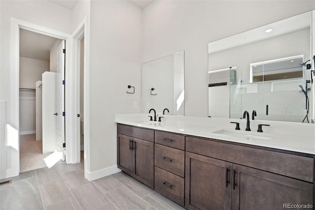 bathroom with a shower and vanity