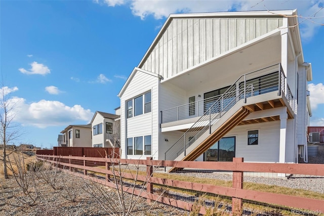 rear view of house featuring a balcony