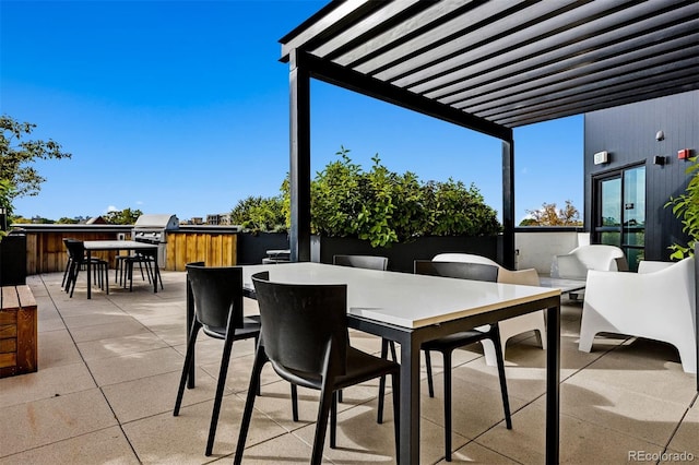 view of patio / terrace with an outdoor bar, exterior kitchen, grilling area, and a pergola