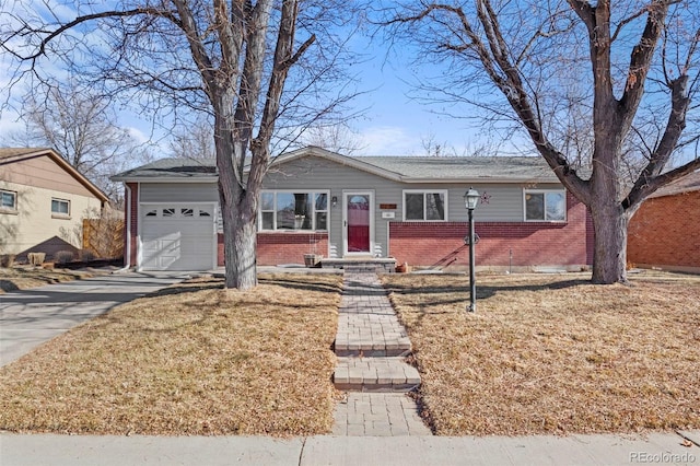 ranch-style house with a garage and a front lawn