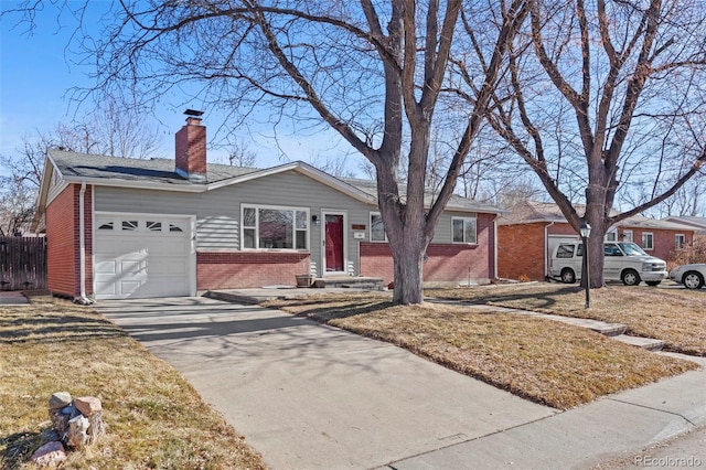 single story home with a garage and a front lawn