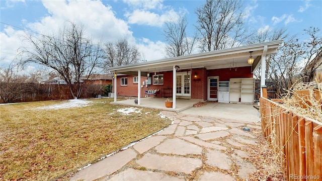 single story home with a patio and a front yard